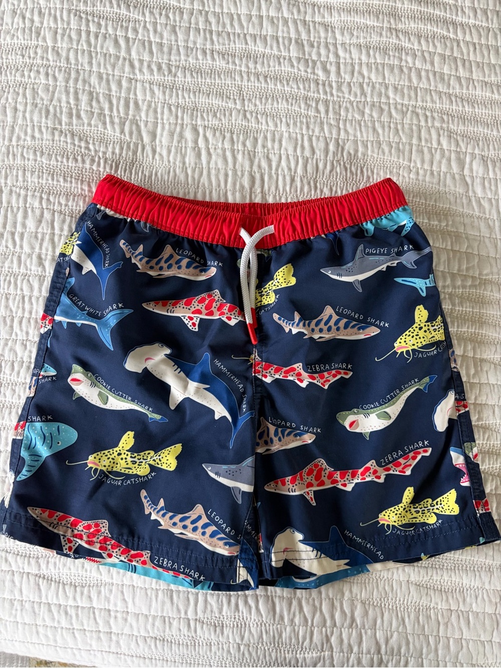 Kids Mini Boden Navy Shark Print Swim Shorts with Red Waistband